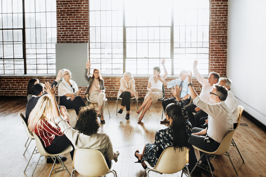 People sitting and talking with a group